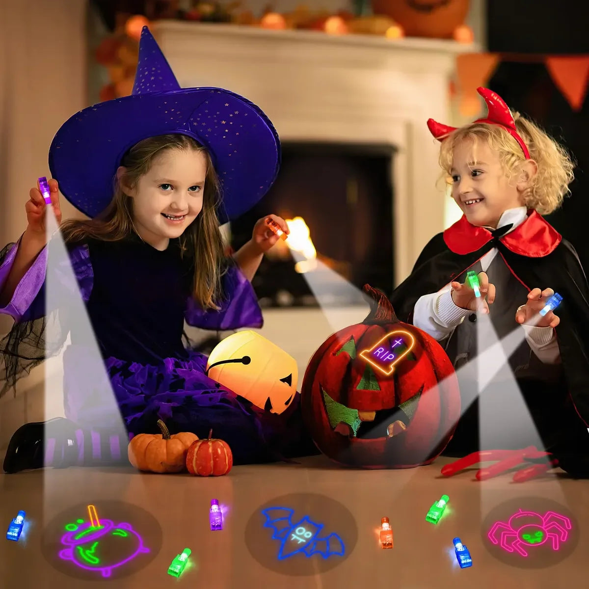 A young girl and boy are shown with Halloween LED finger projector lights illuminating various spooky designs on a table.