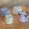A set of three decorative cake toppers featuring pink and cream frosting with bowknot ribbons.