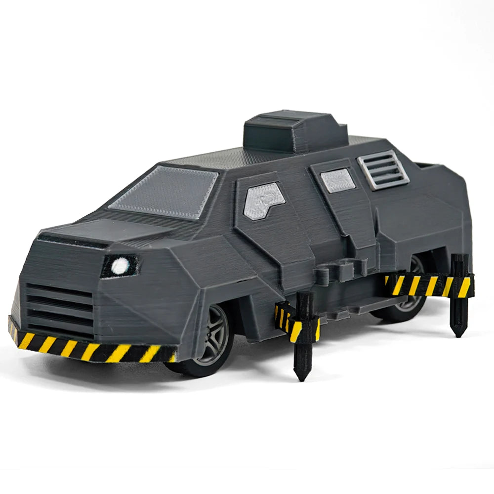 A black 3D printed display model of a Tornado Intercept Vehicle with yellow hazard stripes.