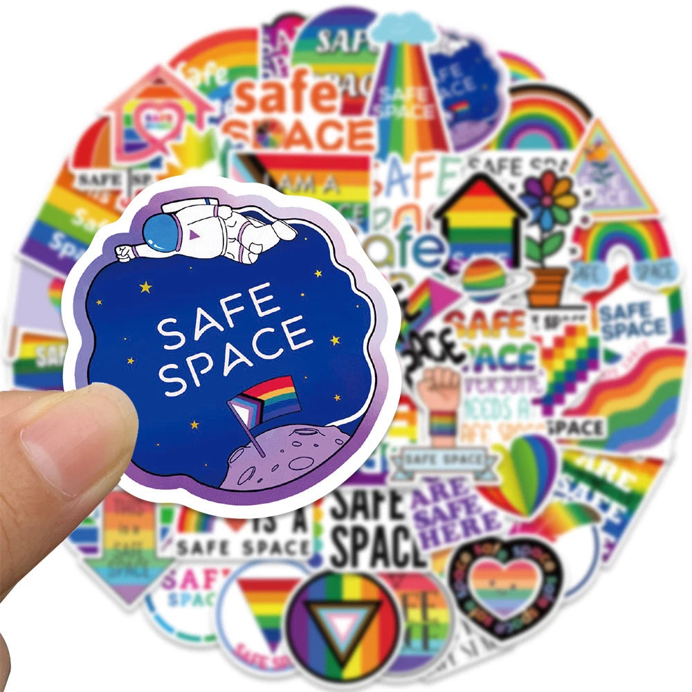 A colorful collage of safe space themed graffiti stickers featuring rainbows, stars, and various symbols.