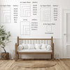 Wall art featuring various aspect ratio grids and a wooden bed frame in a bright room.