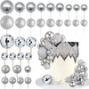 A collection of silver disco ball cake toppers for birthday and party cakes