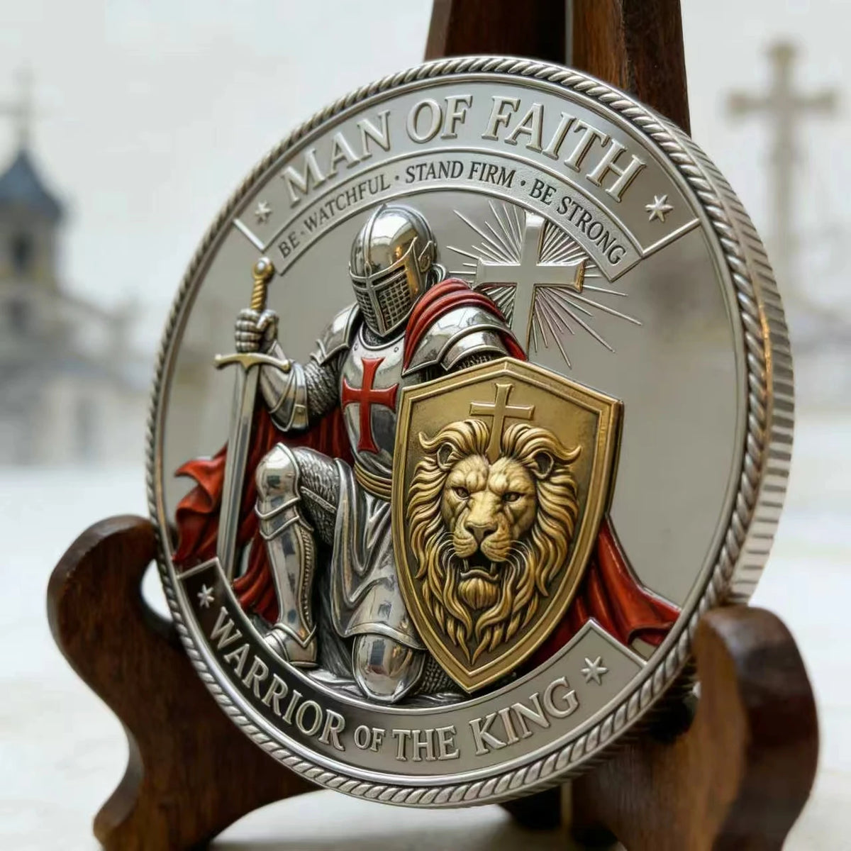 A silver coin featuring a man of faith warrior of the king with a sword and a lion emblem.