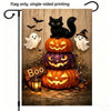 A Halloween flag featuring a black cat, ghost, and carved pumpkins on a wooden background.