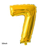 A shiny gold foil balloon shaped like the number 7, measuring 32 inches.