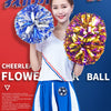 A young woman is holding two bright blue and yellow pom-poms, demonstrating cheerleading skills.