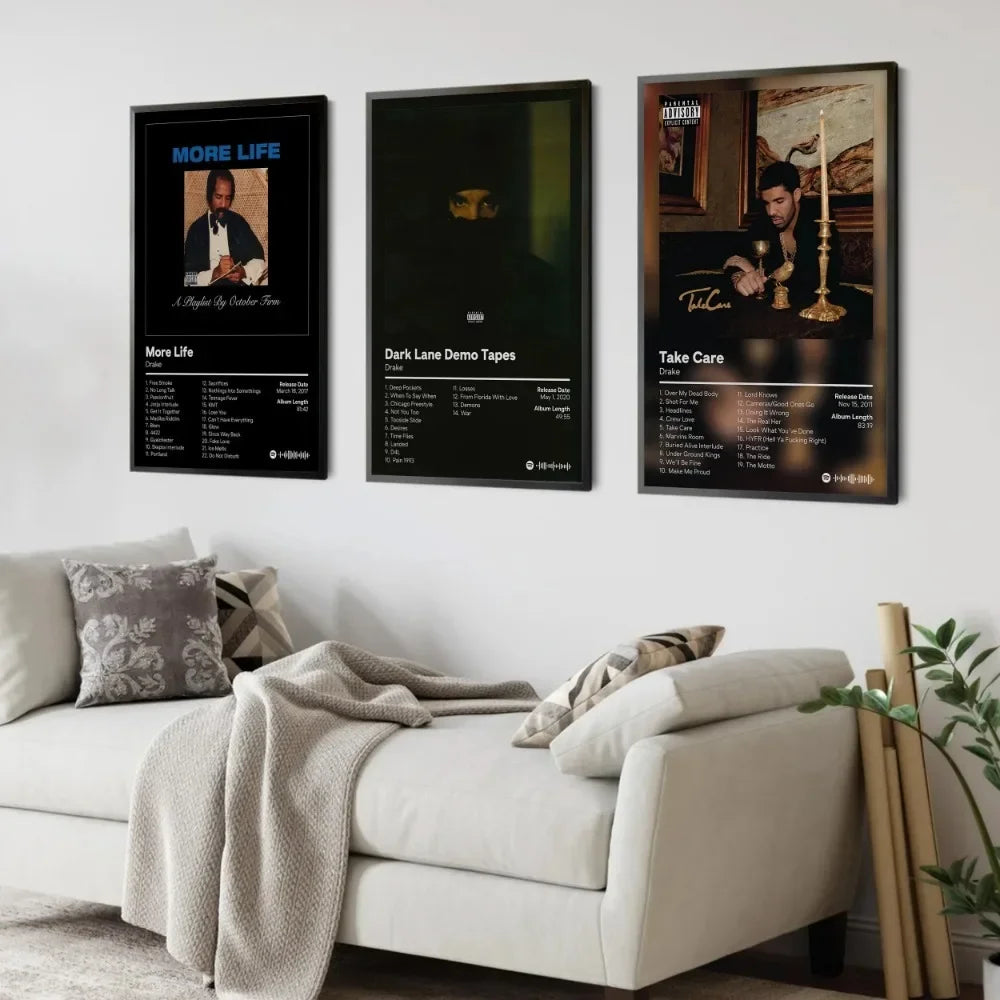 Three framed canvas prints featuring Drake album art and music themes displayed on a white wall.