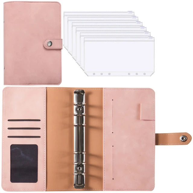 A pink leather planner binder with a cover, interior sheets, and cash envelopes.