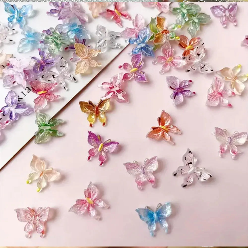 A collection of 50 resin ladybug nail art charms in various shades of pink, purple, and green scattered on a light background