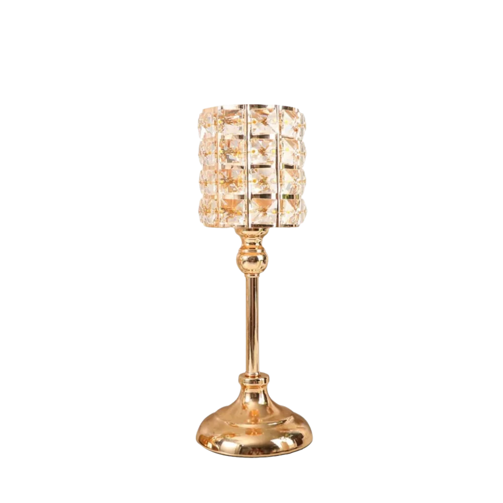 Portavelas de cristal de lujo con cuenco facetado y base dorada.