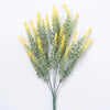 Sprigs of yellow lavender artificial flowers with green foliage