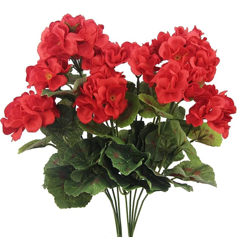 A bouquet of vibrant red silk begonia artificial flowers with green leaves.