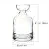 Clear glass avocado seed starter vase with a wide base and narrow neck.