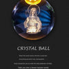 A crystal ball night light showing a glowing figure with a halo against a dark blue background.