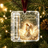 Clear acrylic ornament featuring a nativity scene with an angel and gold glitter set against a green Christmas tree backgroun
