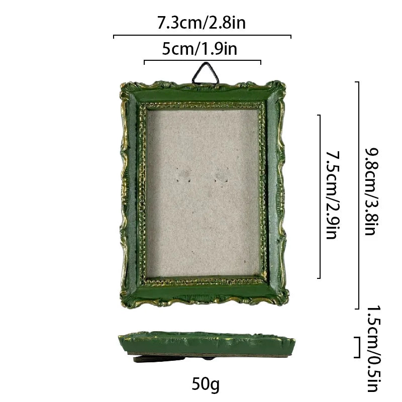 A rectangular vintage baroque resin picture frame with a green frame and light gray interior, shown with dimensions.
