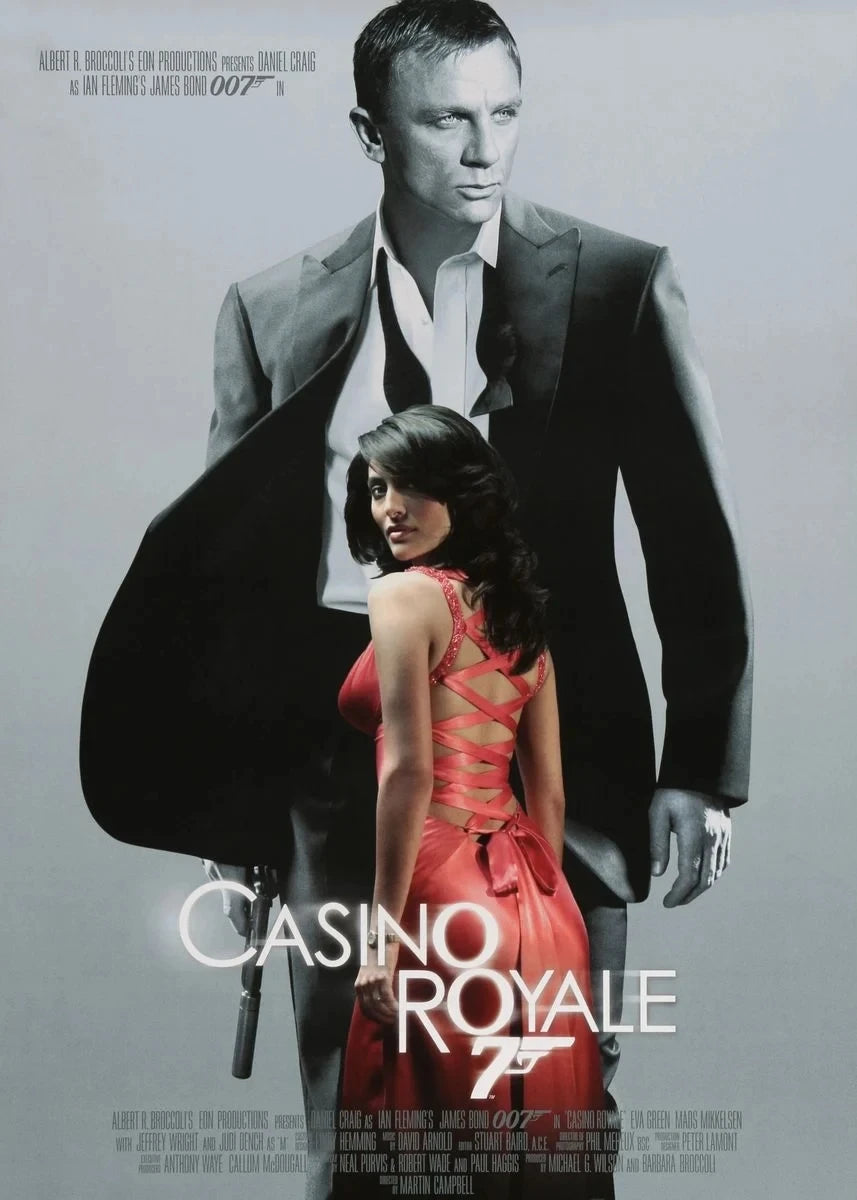 A movie poster featuring a man and a woman in dramatic lighting for Casino Royale.
