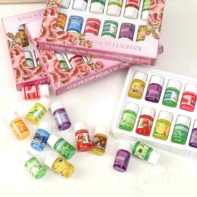 A collection of essential oils in small glass bottles and a box labeled as a certificate for aromatherapy essential oil.