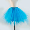 A bright blue tulle tutu skirt displayed on a mannequin.