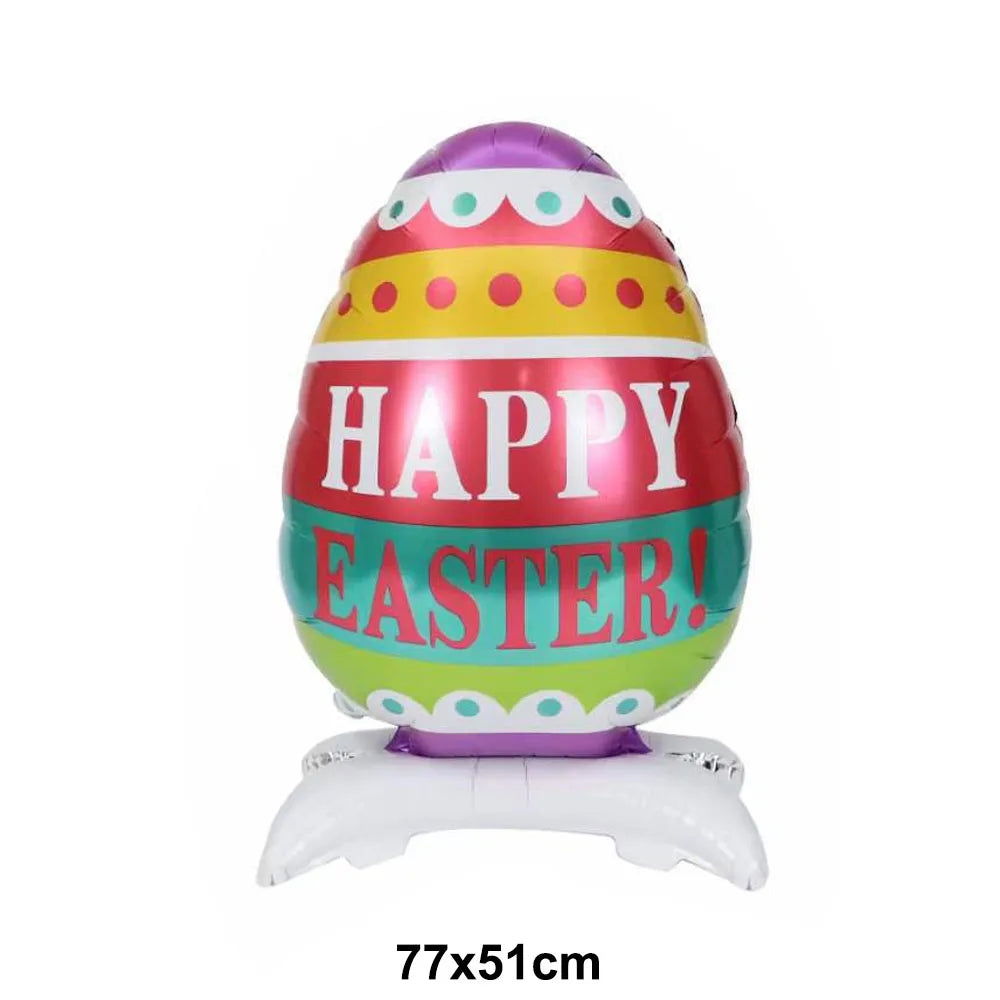 A colorful Easter egg shaped foil balloon with the text HAPPY EASTER on it, resting on a white bunny base.