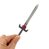 A hand holds a silver metal sword with a lion mark design, used as a keychain or pendant.