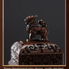 A dark brown, intricately crafted pixiu incense burner featuring a detailed lion figure.