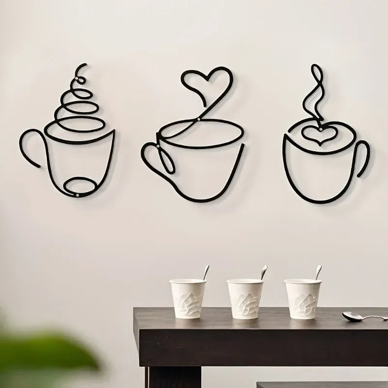 A set of three black iron wall art pieces shaped like steaming coffee cups.
