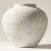 A large matte black decorative vase with a textured, light gray finish is shown from a slight angle.