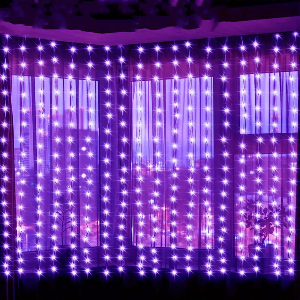 Purple fairy curtain string lights illuminating a window with vertical light strands.
