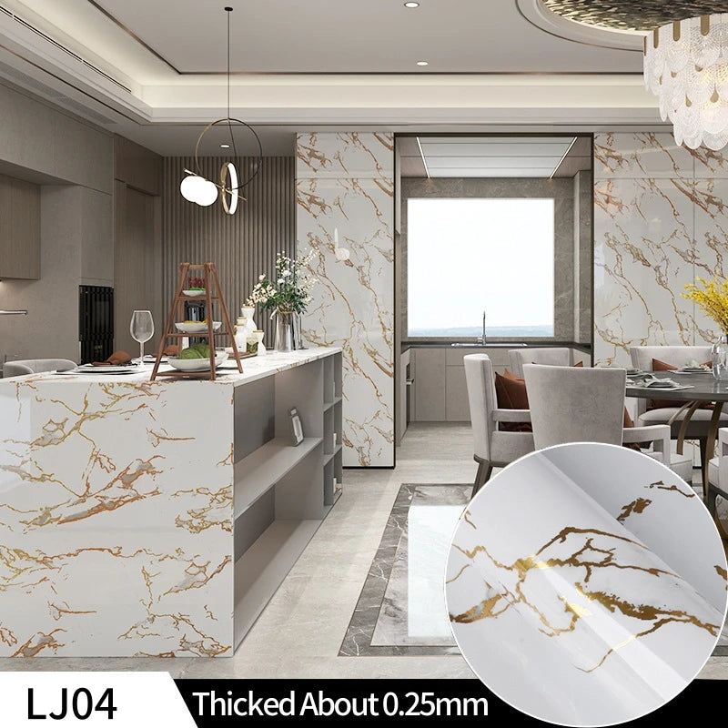A close-up view of a white marble contact paper sheet with gold veining, used for DIY decor.
