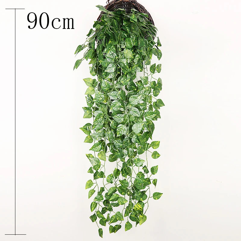 A long, cascading wall hanging of artificial green plant vines in a woven basket.