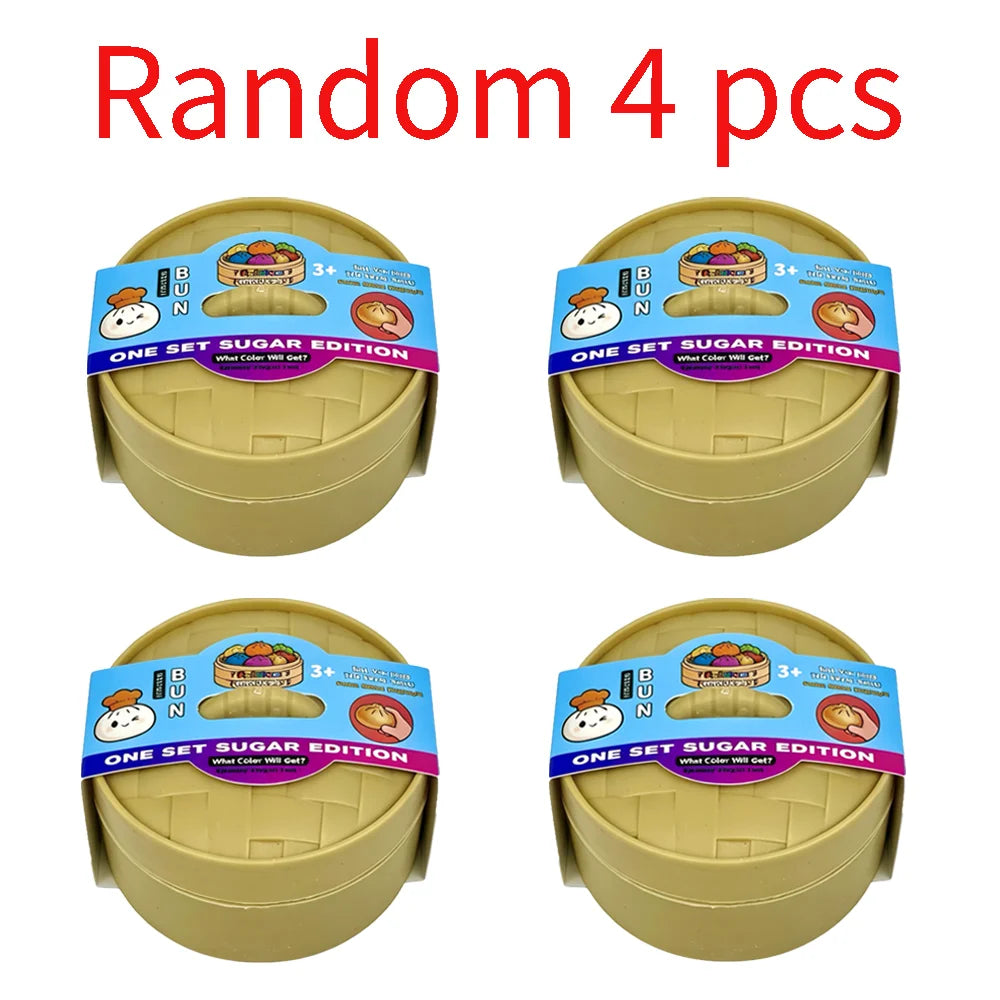 Four yellow squishy toys shaped like dumplings with various colored buns and faces.