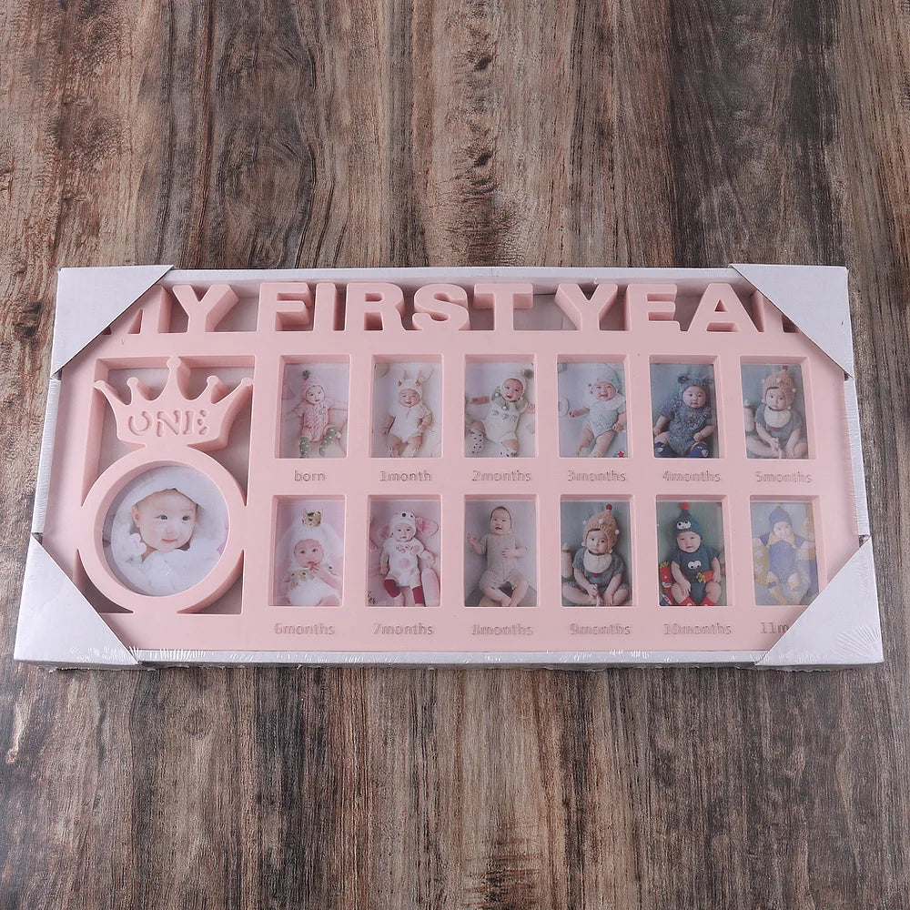 A pink photo frame keepsake showing monthly growth photos of a baby from birth to one year.