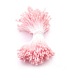 A cluster of pink artificial flower stamens used for DIY decoration.