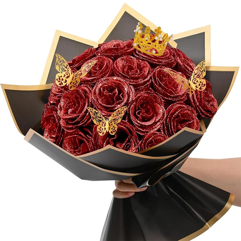 A bouquet of ten deep red glitter artificial roses with a gold crown decoration.