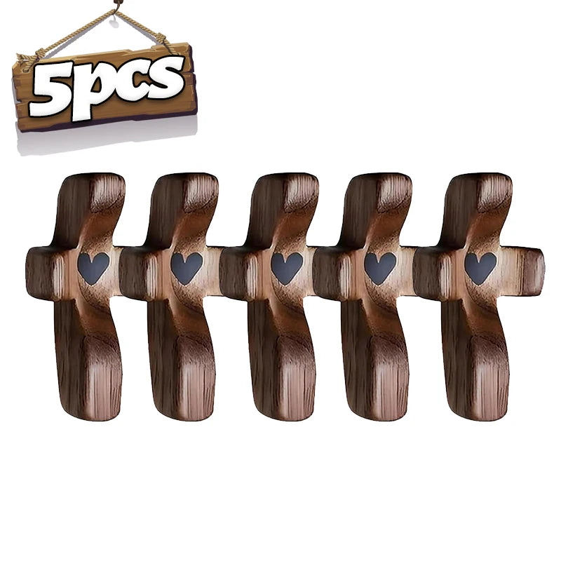 Five wooden pocket crosses for prayer and reflection displayed on a wooden hanger.
