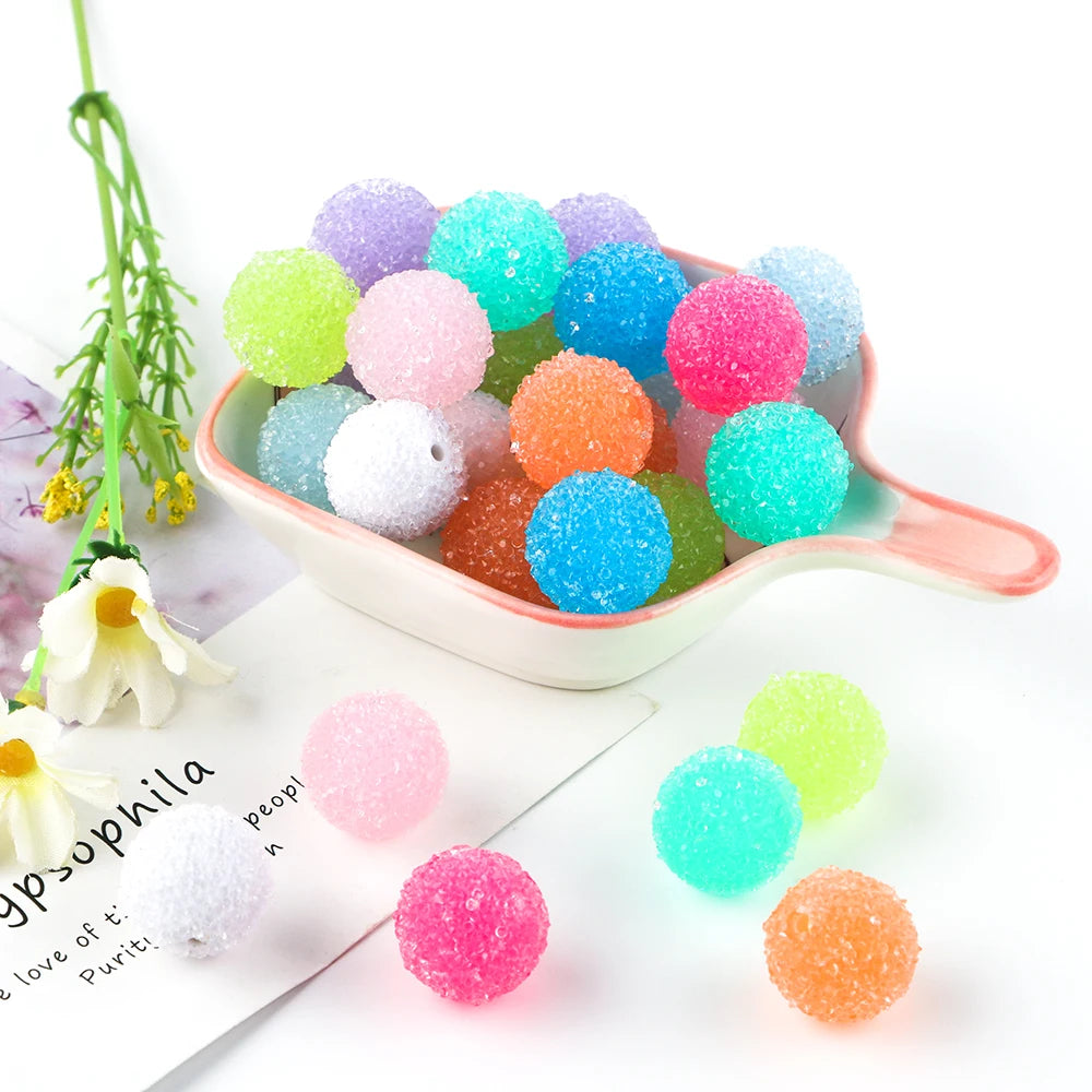 A colorful set of textured resin beads in various shades including pink, green, blue, and orange for jewelry making