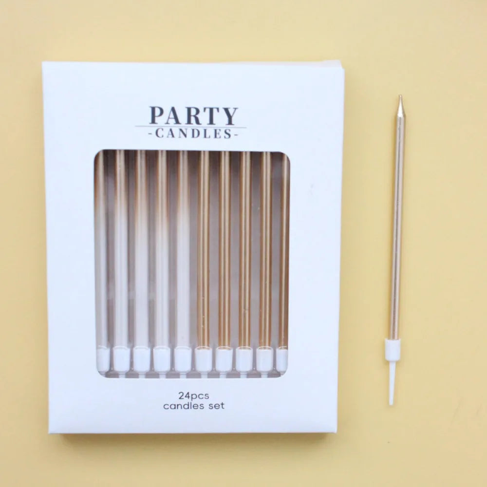 A white box for a set of 24 gradient blue metallic birthday candles with a single candle shown beside it.