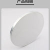 A round, silver cake board is shown in a slight angle against a white background.