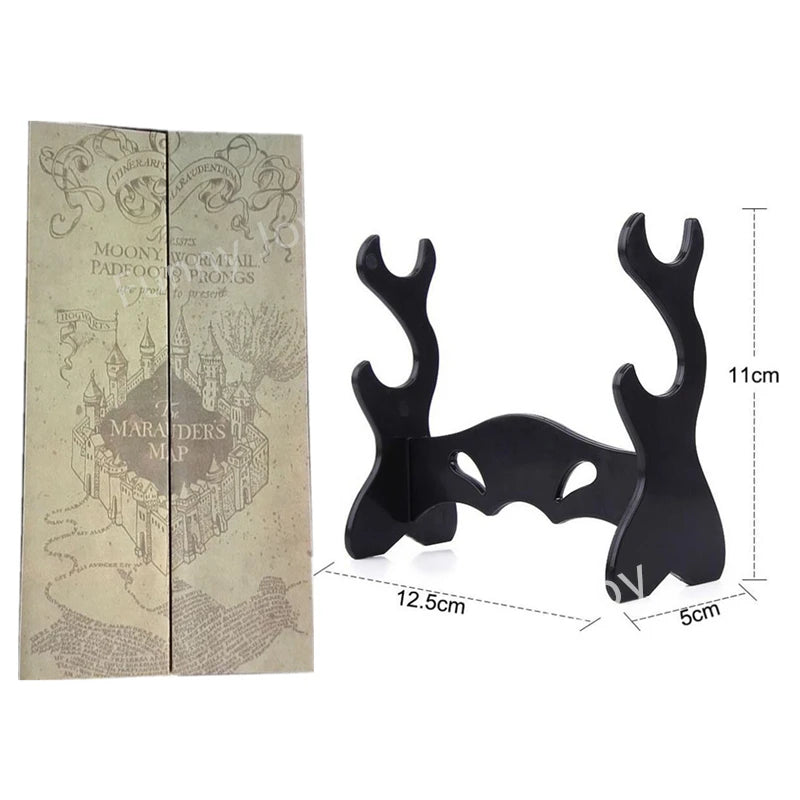 A pair of black metal magic wand replicas for collectors and cosplay, shown next to their packaging.