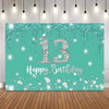 A teal backdrop banner with sparkling glitter and a large silver number 13 and the text Happy Birthday