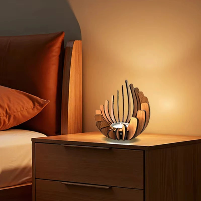 A wooden candle holder decoration sits on a bedside table next to a bed.