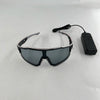 A pair of black light up wire party glasses with a black cord and battery pack.