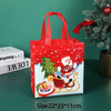 A red non-woven gift tote bag featuring a festive Christmas design with Santa and reindeer.