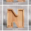Wooden alphabet letters M, N, and O for a piggy bank or coin box.