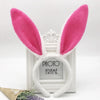 White bunny ear headband with pink fuzzy ears and a photo frame display