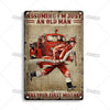 A vintage metal sign featuring a distressed, sepia-toned illustration of a firefighter in a red uniform and a vintage fire tr