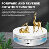 A gold-colored rotating display stand with a deer figure, featuring forward and reverse rotation functions.
