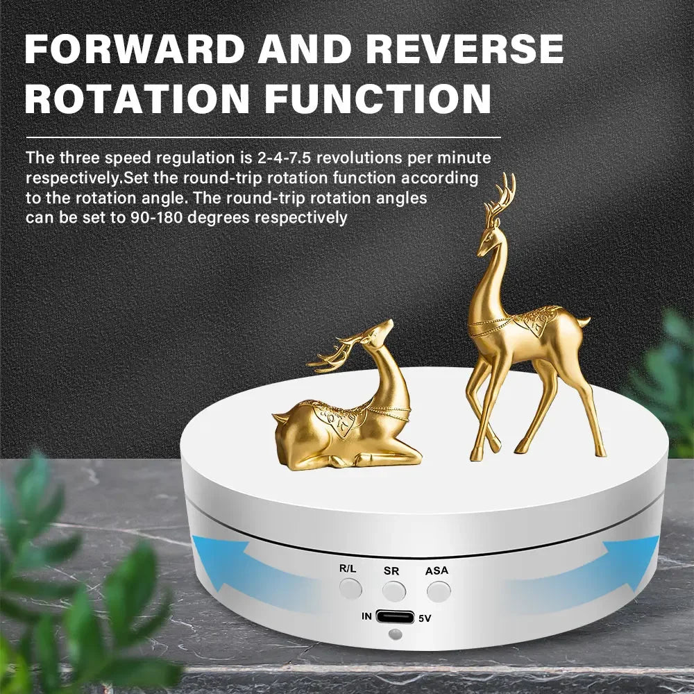 A gold-colored rotating display stand with a deer figure, featuring forward and reverse rotation functions.