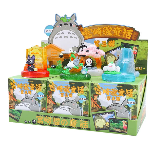 A blind box featuring a lamp ornament and various figurines related to Miyazaki fairy tales.